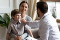 Caring male pediatrician support small kid patient Royalty Free Stock Photo