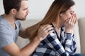 Caring man comfort crying wife making peace after fight Royalty Free Stock Photo