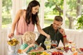 Caring mommy pouring lemonade for her lovely blonde son Royalty Free Stock Photo