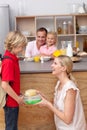 Caring mother packing the school lunch to his son Royalty Free Stock Photo