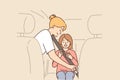 Caring mother uses child seatbelt to fasten little girl into passenger seat of car. Royalty Free Stock Photo
