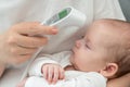 Mother's touch: monitoring baby's health. Concept of technology aiding maternal instincts Royalty Free Stock Photo