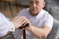 Caring nurse help disabled old male patient in hospital Royalty Free Stock Photo