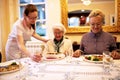 Caring nurse serving meals for dinner Royalty Free Stock Photo