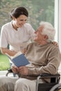 Caring nurse talking with patient