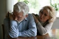 Caring old wife comfort unhappy mature husband after fight Royalty Free Stock Photo