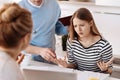 Caring parents helping their daughter with homework Royalty Free Stock Photo