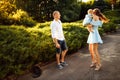 Caring parents with little baby girl walking at the park, enjoy happy family moments, adorable mom hold cute daughter in Royalty Free Stock Photo