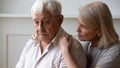 Caring senior wife hug comfort upset elderly husband Royalty Free Stock Photo