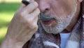 Caring wife feeding old sick husband in clinic, care and love until last day Royalty Free Stock Photo