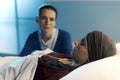 Caring woman assisting her friend with cancer at hospital