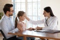 Caring female doctor cheer small girl child patient Royalty Free Stock Photo