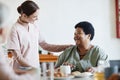 Caring Young Woman Working in Nursing Home