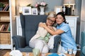 Caring young woman nurse help old granny during homecare medical visit, female caretaker doctor talk with elder lady give empathy Royalty Free Stock Photo