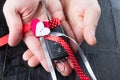 Cark key with a red ribbon on black wooden table. Giving present or gift