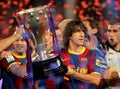 Carles Puyol holds La Liga Trophy