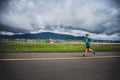 Lonely Man Leading a Group of 10K Runners Royalty Free Stock Photo