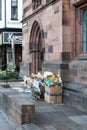 Carlisle, Cumbria, UK - 27 09 2020 Cardboard and waste paper in front of a church ready for recycling. Pile of cardboard to be rec