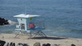 Carlsbad, CA / USA - April 25, 2020: A lifeguard tower sits on an empty beach closed due to Covid-19.