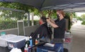 Carlsbad, CA / USA - August 24, 2020: An older man is getting a haircut outside in times of Covid-19 Phase 2 reopening