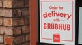 Carlsbad, CA / USA - March 28, 2020: Sign for Grubhub delivery on a restaurant window