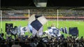 Carlton Blues supporters waving flags after a goal at Docklands Stadium, Melbourne