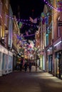 Carnaby Street Christmas decorations above late night shoppers