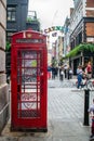 CARNABY STREET, LONDON, ENGLAND- 4 September 2021: Red phone box in Carnaby Street in London, England Royalty Free Stock Photo