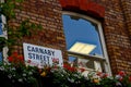 Carnaby Street sign with window and potted flowers London England Royalty Free Stock Photo