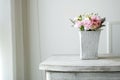Carnation flower in cement pot on vintage cabinet at the bedroom Royalty Free Stock Photo