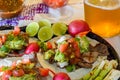 Carne asada tacos with craft beer and condiments in Tijuana with copy space Royalty Free Stock Photo
