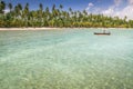 Carneiros idyllic beach with rustic boat at sunny day, in Northeastern Brazil