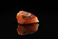 Carnelian Uncut Gem Stone on Black Background