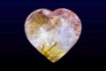 Carneol Agate Carved Heart Polished gem on dark background. Macro shot Royalty Free Stock Photo