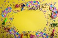 Carnival or birthday party. Confetti and serpentines on bright yellow background