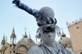 Carnival blue-silver mask and costume at the traditional festival in Venice, Italy