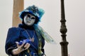 Carnival blue-silver mask and costume at the traditional festival in Venice, Italy