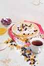 Carnival celebration, delicious pancakes close-up, with a fresh blueberry and sea buckthorn, cherries honey.