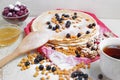 Carnival celebration, delicious pancakes close-up, with a fresh blueberry and sea buckthorn, cherries honey. Royalty Free Stock Photo