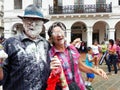 Carnival in Cuenca, Ecuador. Couple with a lot of foam on their faces