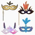 Carnival face masks with feathers and handle. Set of decoration for masquerade party. Vector. Royalty Free Stock Photo