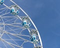 Ferris Wheel against a blue sky background