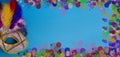 Carnival. Festive banner background with copy space. Carnival mask with feathers on a blue background. Mardi Gras. Brazilian