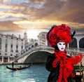 Carnival mask against Rialto bridge in Venice, Italy Royalty Free Stock Photo