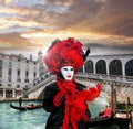 Carnival mask against Rialto bridge in Venice, Italy Royalty Free Stock Photo