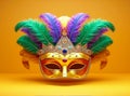 A carnival mask with feathers on a yellow background, Mardi Gras mask with colorful feathers.