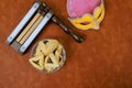 Carnival mask, hamantaschen cookies, noisemakers, were used to celebrate a Jewish holiday of Purim