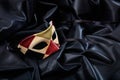 Carnival mask isolated on black satin background Royalty Free Stock Photo