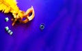 Carnival mask on purple background with sparkles. Festive backdrop for projects Royalty Free Stock Photo