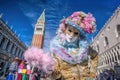 Carnival mask on San Marco square in Venice, Italy Royalty Free Stock Photo